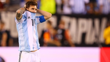 Lionel Messi No. 10 of Argentina looks on before the game winning penalty kick is made.