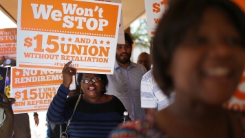 Protesters in support of a $15 an hour minimum wage march together on September 10, 2015 in Fort Lauderdale, Florida.