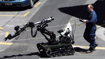 An operator controls bomb-disarming robot in Auckland, New Zealand.