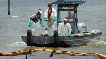 Crews work to clean up after the 2010 BP oil spill.