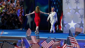 Chelsea Clinton gives her mom a hug onstage at the Democratic National Convention.