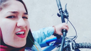 A woman in Iran takes a selfie to protest country's bike ban.