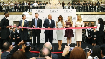 Trump and his children cut the ribbon at his D.C. hotel
