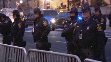 Police guard the Inauguration parade route.