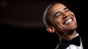 Former president Barack Obama smiling