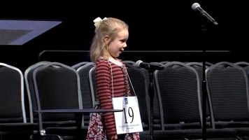 Five-year-old spelling bee champion Edith Fuller spells a word during the competition.