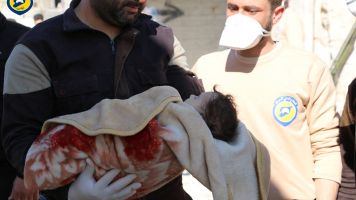 Volunteers with the Syrian Civil Defense hold an infant affected by the chemical attack in Khan Shaykhun, Syria.