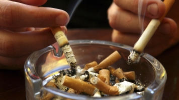 Cigarettes over an ashtray.