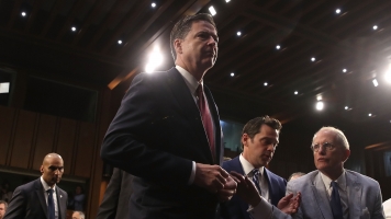 Fired FBI Director James Comey in Senate Intelligence Committee hearing room