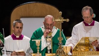 Pope Francis prepares for Communion