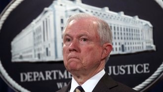 Attorney General Jeff Sessions listens during a news conference.