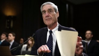 Former Federal Bureau of Investigation (FBI) Director Robert Mueller waits for the beginning of a hearing.