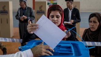 A woman votes in Kurdish referendum