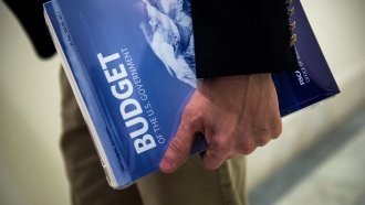 A congressional House staffer holds the 2017 Budget