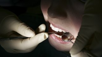 A patient receives dental treatment.