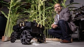 Agricultural and biological engineering professor Girish Chowdhary pictured next to TerraSentia