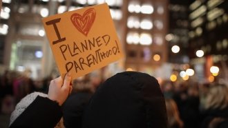 Demonstrators protest in Chicago to voice their support for Planned Parenthood and reproductive rights.