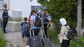 A family crosses into Canada at an irregular border crossing.
