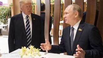 U.S. President Donald Trump talks with Russian President Vladimir Putin