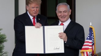 U.S. President Donald Trump and Prime Minister of Israel Benjamin Netanyahu show the proclamation Trump signed.