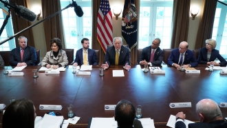 President Donald Trump leads a meeting with his cabinet members.