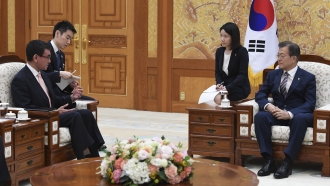 Japan's Foreign Minister and South Korean President Moon Jae-in