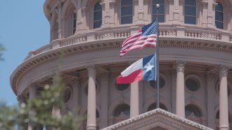 Texas Capitol and flag