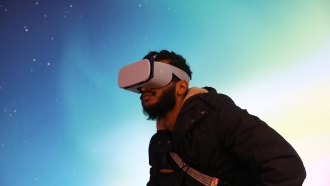 Man looking through VR headset