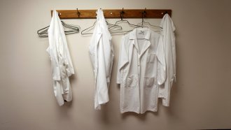 Lab coats on a rack