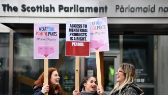 Women rally for period products bill outside the Scottish Parliament