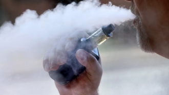 Person uses a vaping device