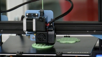 3D printer makes parts for masks