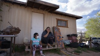 Navajo Nation members on a porch