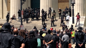 Armed NFAC protesters demand justice for Breonna Taylor in Louisville, Kentucky on July 25, 2020