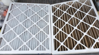 New clean air filter next to dirty air filter