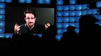 Former U.S. National Security Agency contractor Edward Snowden addresses attendees at the Web Summit technology conference.