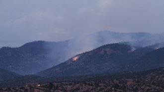 Smoke drifts from fires in Santa Fe National Forest near Santa Fe, N.M.