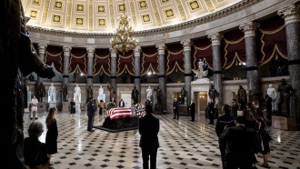 A casket containing the remains of Supreme Court Justice Ruth Bader Ginsburg sits in Statuary Hall