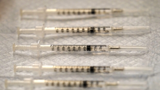 Pfizer-BioNTech vaccine syringes are seen at Edward Hospital in Naperville, Ill.
