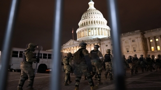 Members of the National Guard arrive to secure the area outside the U.S. Capitol, Wednesday, Jan. 6, 2021, in Washington.