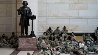 Troops hold inside the Capitol Visitor's Center to reinforce security at the Capitol in Washington,