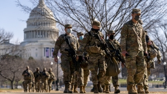 Members of the National Guard walk near U.S. Capitol building