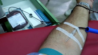 A person donates blood.