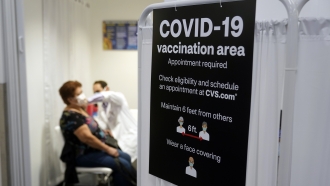 Woman gets COVID-19 vaccine