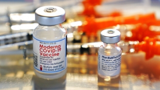 File photo, vials for the Moderna and Pfizer COVID-19 vaccines