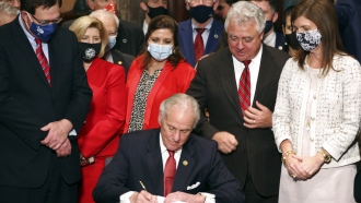 South Carolina Gov. Henry McMaster signs into law a bill banning almost all abortions