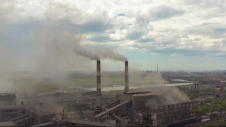 A factory blows pollution into the air.