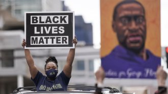 Woman holding Black Lives Matter sign