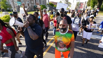 Protesters march along the streets to protest the shooting of Andrew Brown Jr.