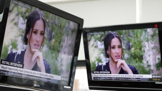 ustralian television news in Sydney, Monday, March 8, 2021, reports on an interview of The Duke and Duchess of Sussex